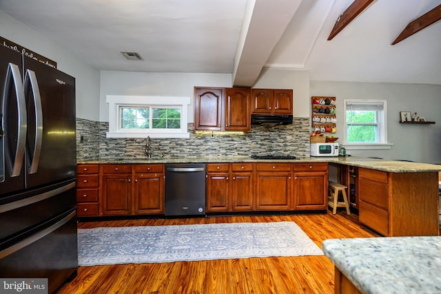 877 Salford Station Rd, Schwenksville, PA 19473 - kitchen with stainless steel appliances, ventilation hood, a peninsula, dark wood-type flooring, and tasteful backsplash