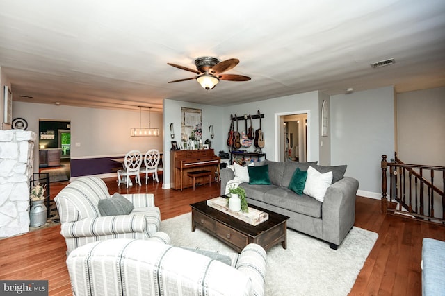 877 Salford Station Rd, Schwenksville, PA 19473 - living area with wood finished floors, a ceiling fan, a chandelier, and baseboards