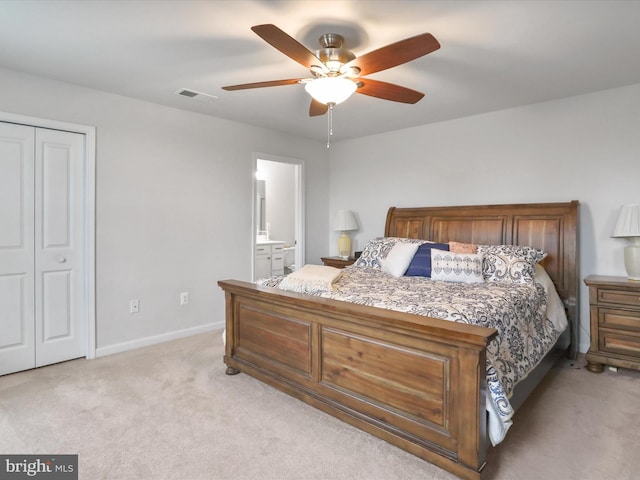 171 Cougill Rd, Middletown, VA 22645 - bedroom featuring light colored carpet, baseboards, a closet, ceiling fan, and connected bathroom