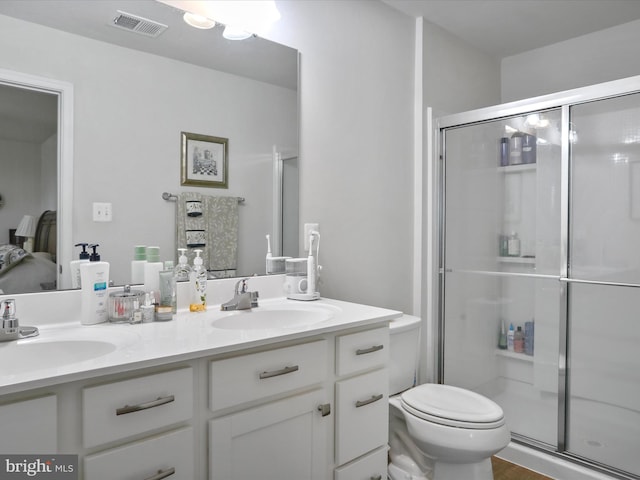 171 Cougill Rd, Middletown, VA 22645 - bathroom featuring a shower stall, double vanity, and toilet