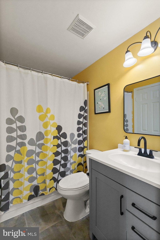 bathroom featuring visible vents, vanity, toilet, tile patterned floors, and a shower with curtain
