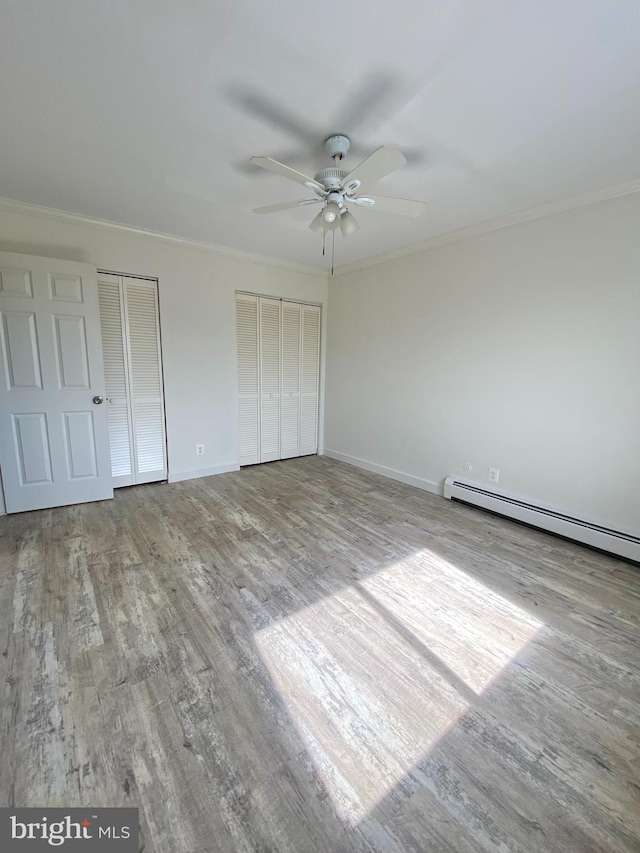 4901 Harbor Beach Blvd Unit P12, Brigantine, NJ 08203 - unfurnished bedroom featuring wood finished floors, baseboards, crown molding, and two closets