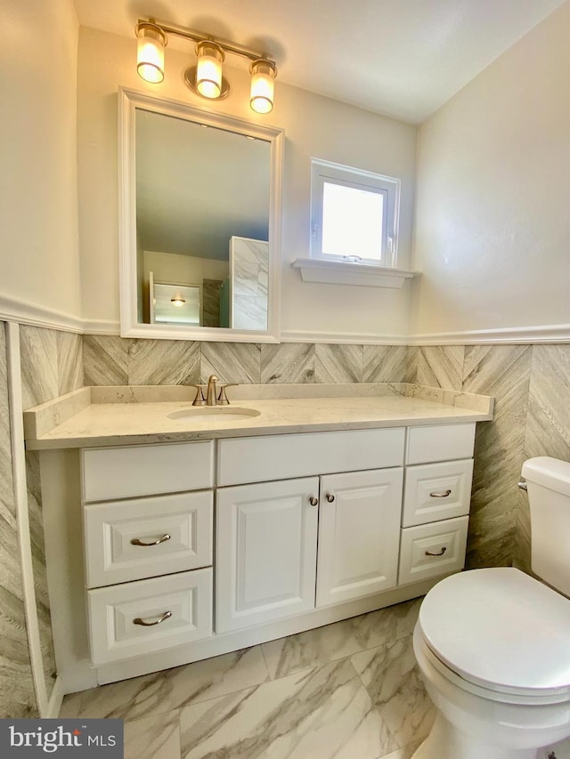 4901 Harbor Beach Blvd Unit P12, Brigantine, NJ 08203 - bathroom with tile walls, a wainscoted wall, vanity, toilet, and marble finish floor