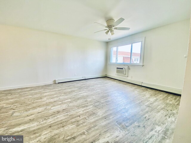 4901 Harbor Beach Blvd Unit P12, Brigantine, NJ 08203 - spare room featuring baseboards, a ceiling fan, a wall mounted AC, and wood finished floors