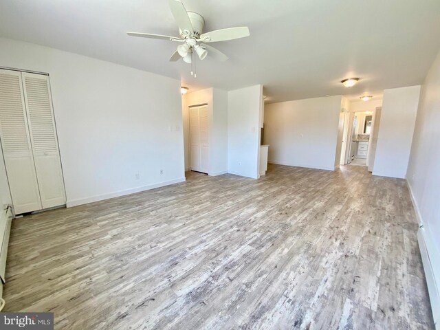 4901 Harbor Beach Blvd Unit P12, Brigantine, NJ 08203 - unfurnished living room featuring light wood-style floors, a ceiling fan, and baseboards