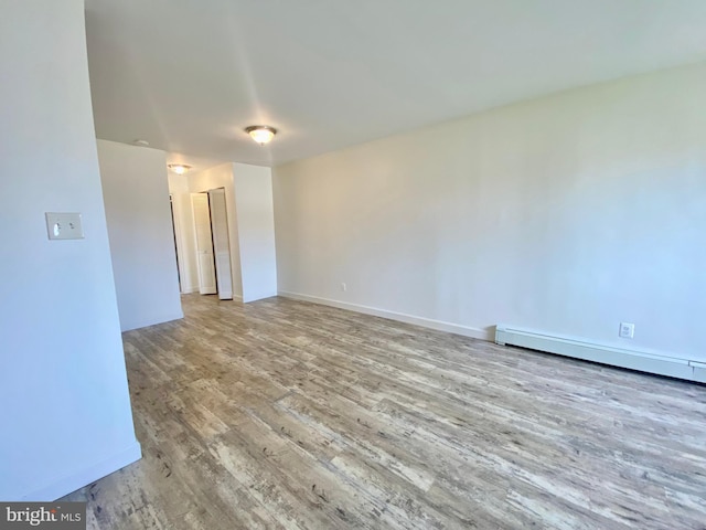 4901 Harbor Beach Blvd Unit P12, Brigantine, NJ 08203 - spare room with baseboards, wood finished floors, and baseboard heating