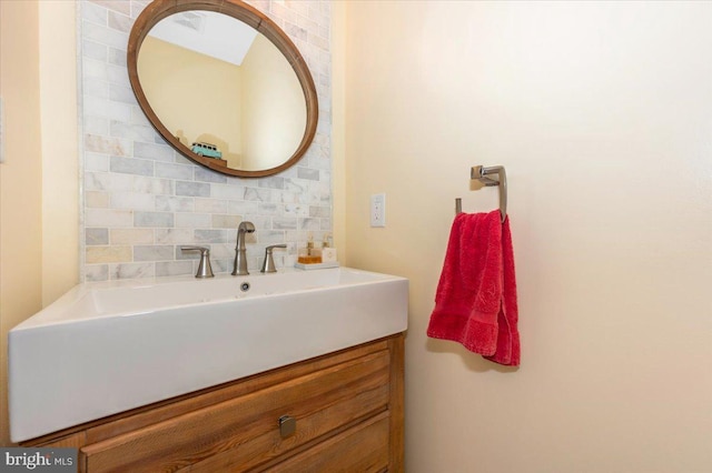 bathroom featuring backsplash and vanity