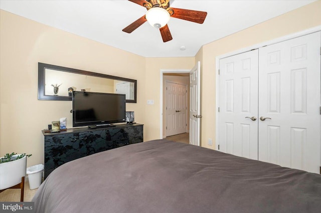 bedroom featuring a ceiling fan and a closet