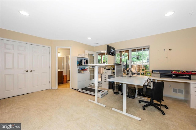office with light colored carpet and recessed lighting