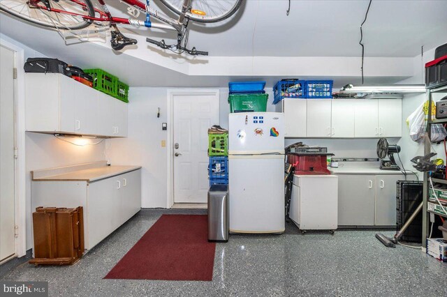 garage with freestanding refrigerator