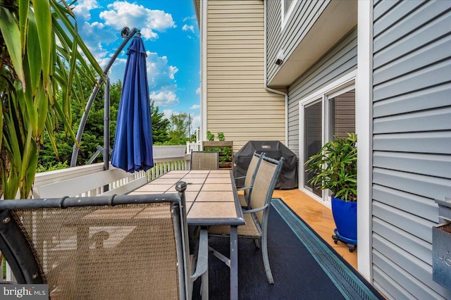view of patio with outdoor dining space and grilling area