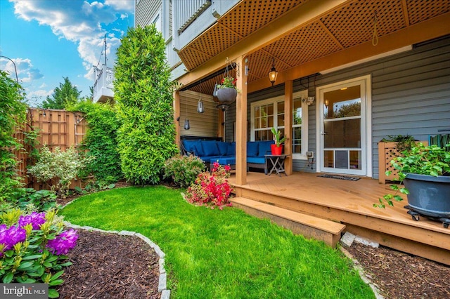 view of yard featuring outdoor lounge area and a wooden deck