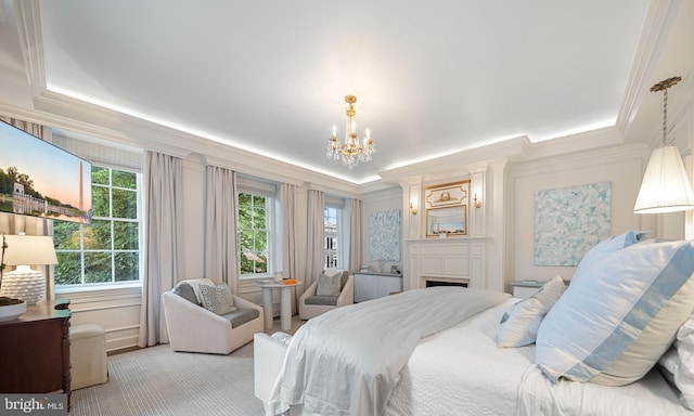 109 Duke St, Alexandria, VA 22314 - bedroom with a tray ceiling, ornamental molding, a chandelier, a fireplace, and light carpet