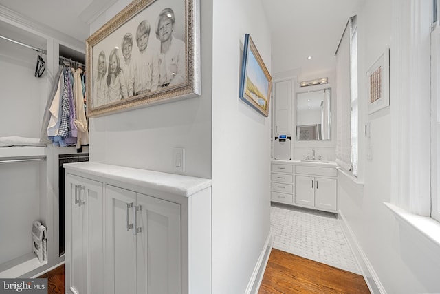 109 Duke St, Alexandria, VA 22314 - bathroom with vanity, baseboards, and wood finished floors