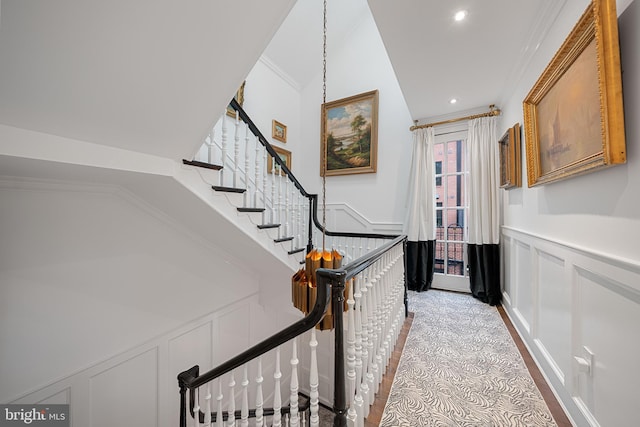 109 Duke St, Alexandria, VA 22314 - corridor with a decorative wall, a wainscoted wall, stairs, ornamental molding, and lofted ceiling