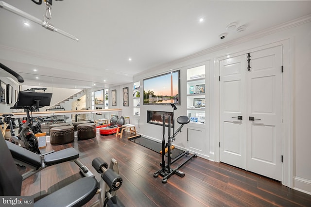 109 Duke St, Alexandria, VA 22314 - exercise room with dark wood finished floors, ornamental molding, and recessed lighting