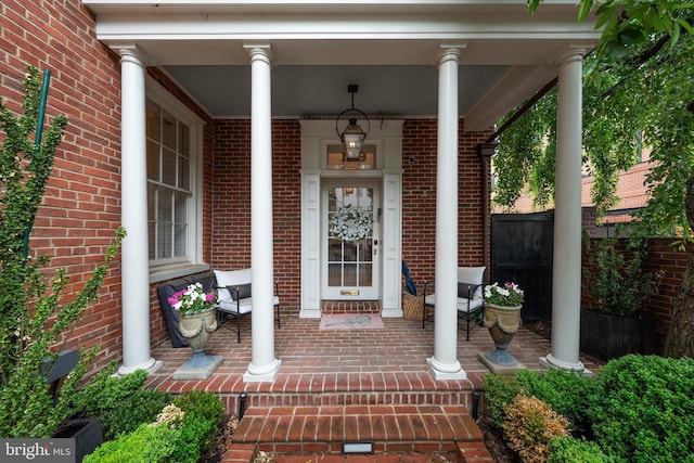 109 Duke St, Alexandria, VA 22314 - property entrance with a porch and brick siding