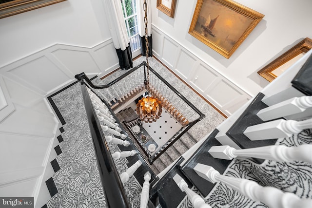 109 Duke St, Alexandria, VA 22314 - detailed view of a decorative wall, a wainscoted wall, and a chandelier