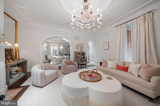 109 Duke St, Alexandria, VA 22314 - living room with arched walkways, a chandelier, ornamental molding, baseboards, and wood finished floors