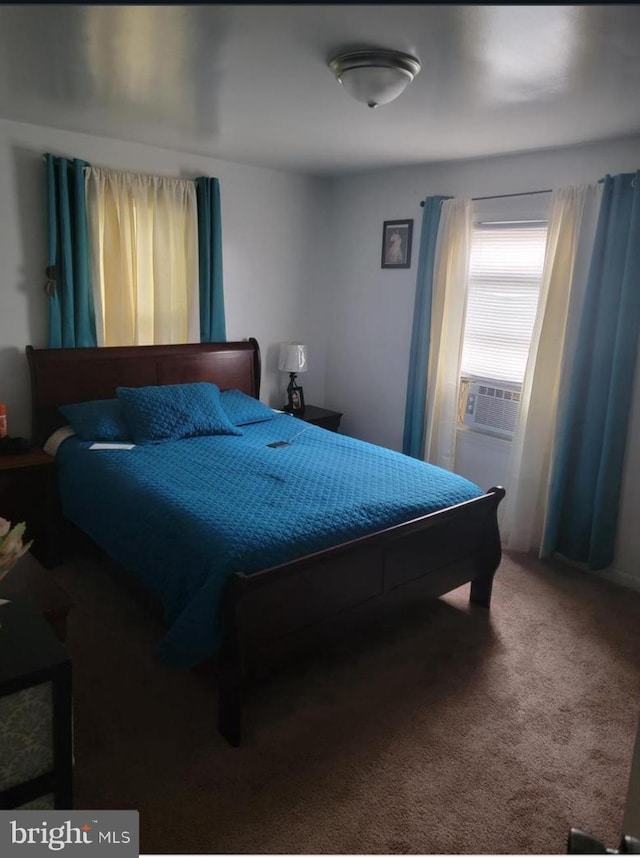 bedroom with carpet floors and cooling unit
