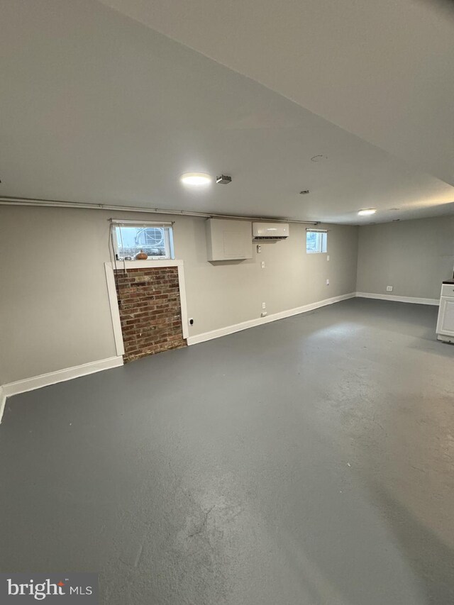 2117 Kearny St NE, Washington, DC 20018 - basement featuring an AC wall unit and baseboards