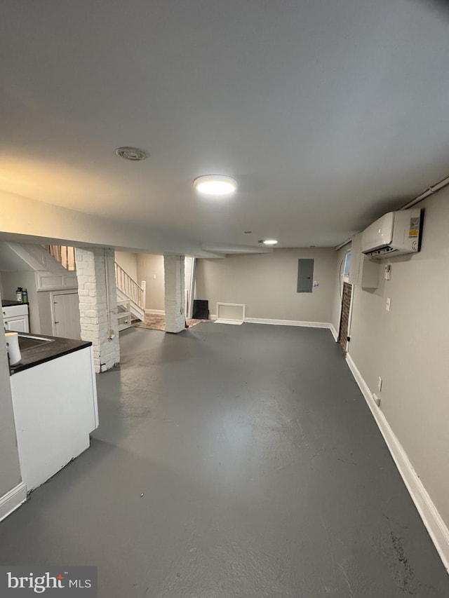 2117 Kearny St NE, Washington, DC 20018 - finished below grade area with a wall mounted air conditioner, stairway, electric panel, and baseboards