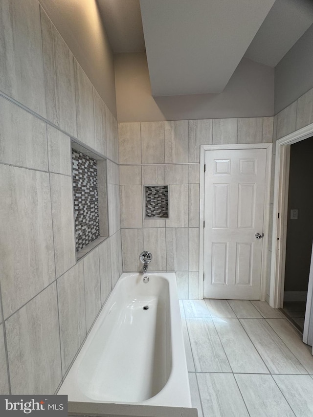 2117 Kearny St NE, Washington, DC 20018 - bathroom with a bath and tile walls