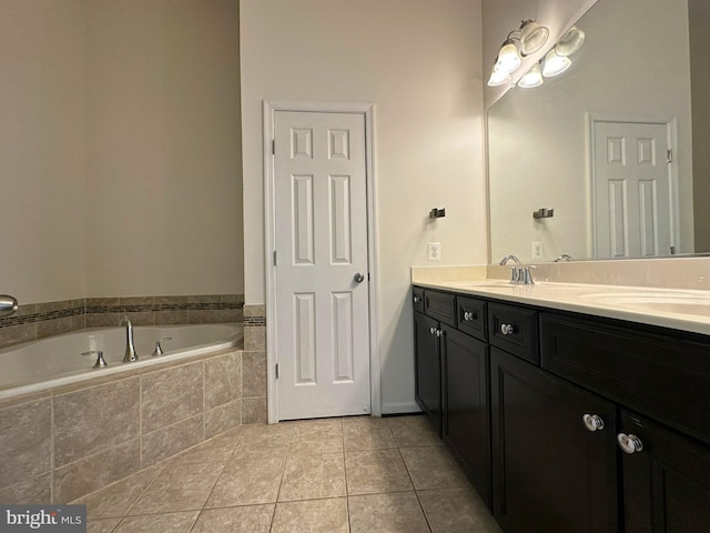 bathroom featuring tile patterned flooring, a garden tub, and double vanity