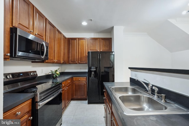24764 Stone Station Ter, Aldie, VA 20105 - kitchen with stainless steel appliances, a sink, dark countertops, light tile patterned floors, and vaulted ceiling
