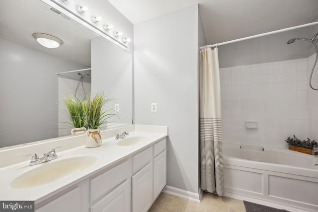 24764 Stone Station Ter, Aldie, VA 20105 - full bath featuring shower / bath combo with shower curtain, tile patterned floors, double vanity, and baseboards