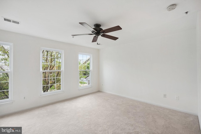 24764 Stone Station Ter, Aldie, VA 20105 - spare room with healthy amount of natural light, a smoke detector, carpet, and a ceiling fan