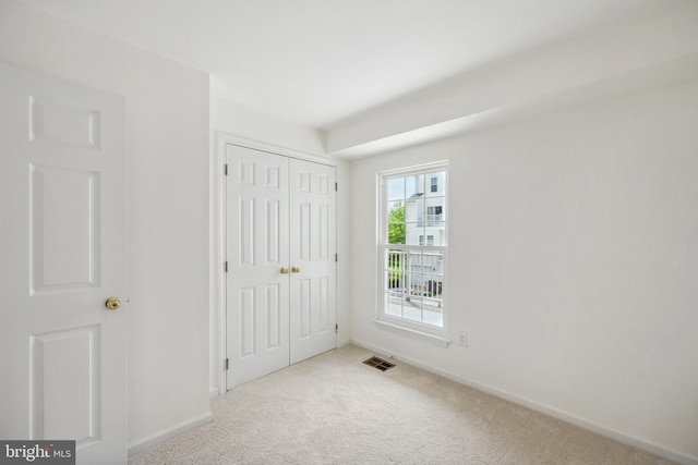 24764 Stone Station Ter, Aldie, VA 20105 - unfurnished bedroom featuring carpet floors, baseboards, and a closet