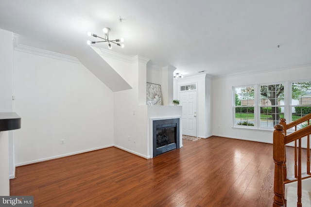 24764 Stone Station Ter, Aldie, VA 20105 - unfurnished living room with a chandelier, ornamental molding, wood finished floors, baseboards, and stairs