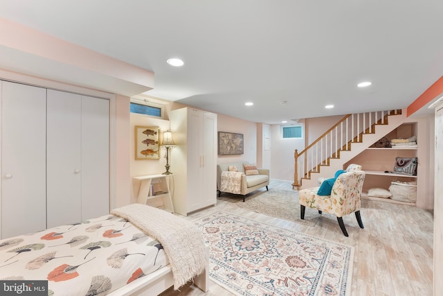 bedroom featuring a closet, light wood-style flooring, and recessed lighting