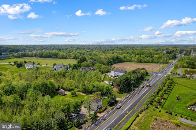 birds eye view of property featuring a forest view
