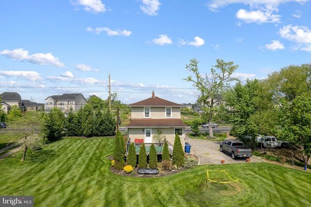 view of front of house with a front lawn