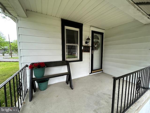 doorway to property with a porch