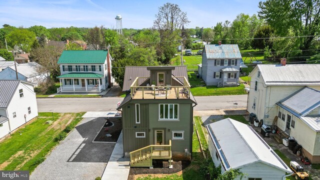 birds eye view of property with a residential view