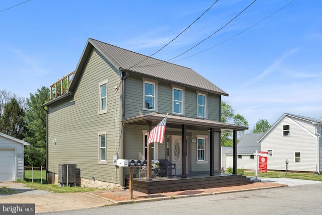 view of front of home featuring a porch, central AC, and metal roof