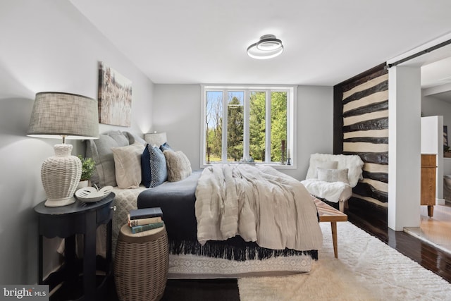 bedroom with wood finished floors