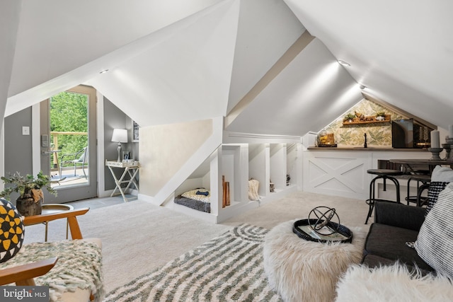 additional living space with carpet floors and lofted ceiling