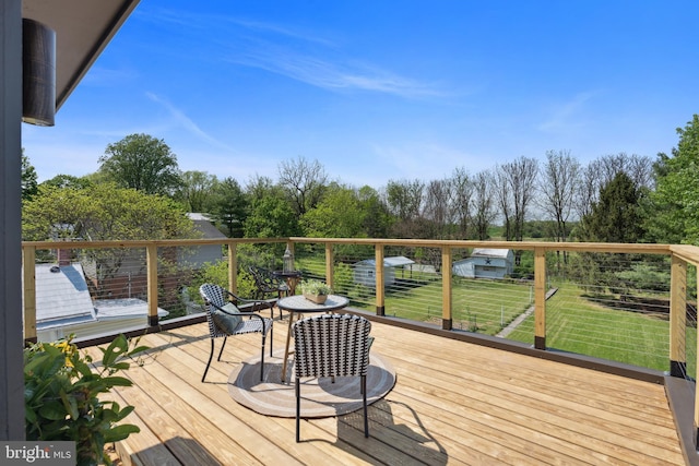 deck featuring a yard
