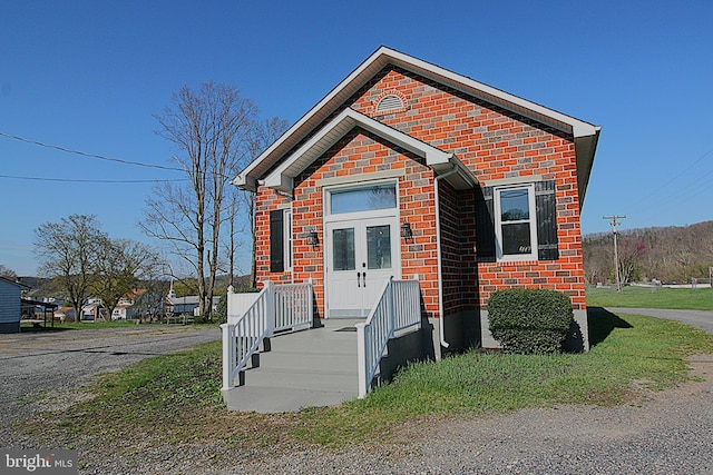 577 Winchester St, Paw Paw, WV 25434 - view of front of home with brick siding and french doors