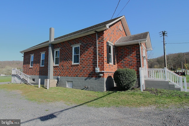 577 Winchester St, Paw Paw, WV 25434 - view of property exterior featuring a chimney and brick siding
