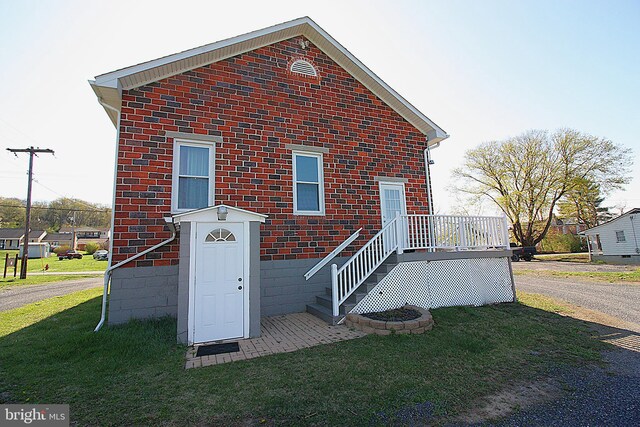 577 Winchester St, Paw Paw, WV 25434 - view of front facade with a front lawn and brick siding