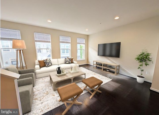 living room featuring recessed lighting, baseboards, and wood finished floors