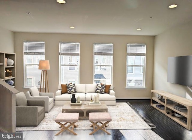 living area with hardwood / wood-style flooring, recessed lighting, and a wealth of natural light