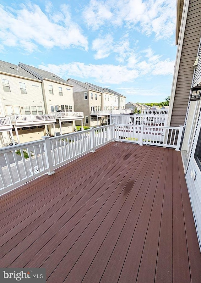 wooden terrace with a residential view