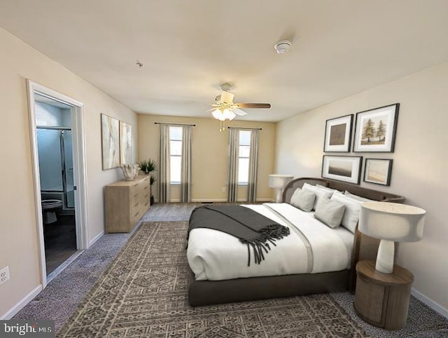 bedroom with a ceiling fan, baseboards, ensuite bathroom, and carpet