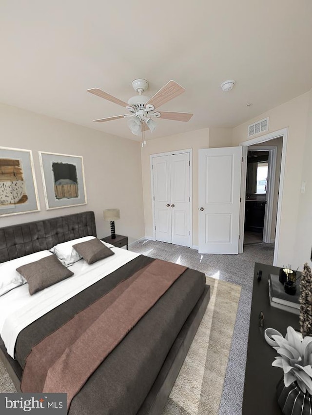 bedroom with carpet flooring, a ceiling fan, baseboards, visible vents, and a closet